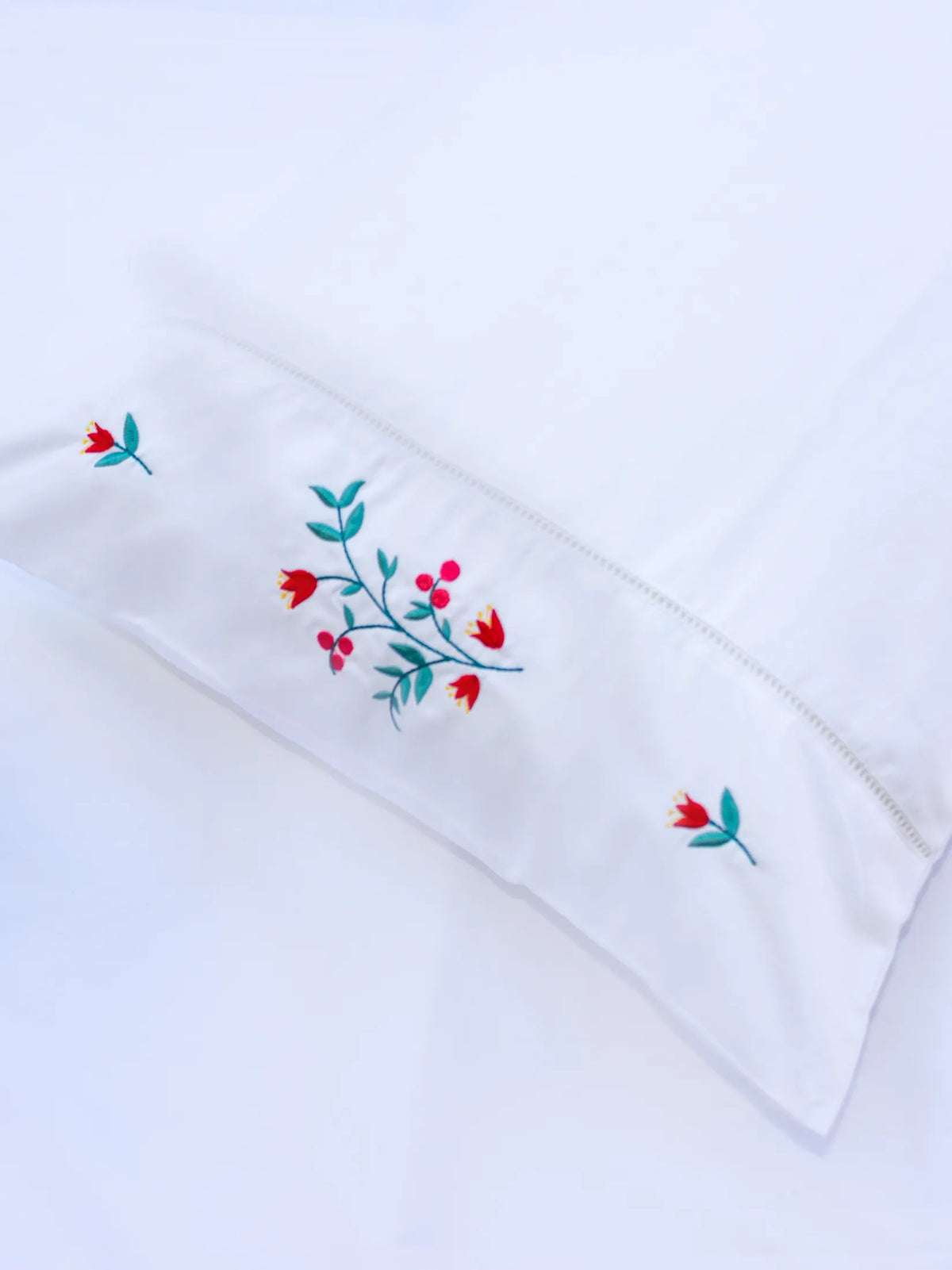 Bedlinen with red embroidery