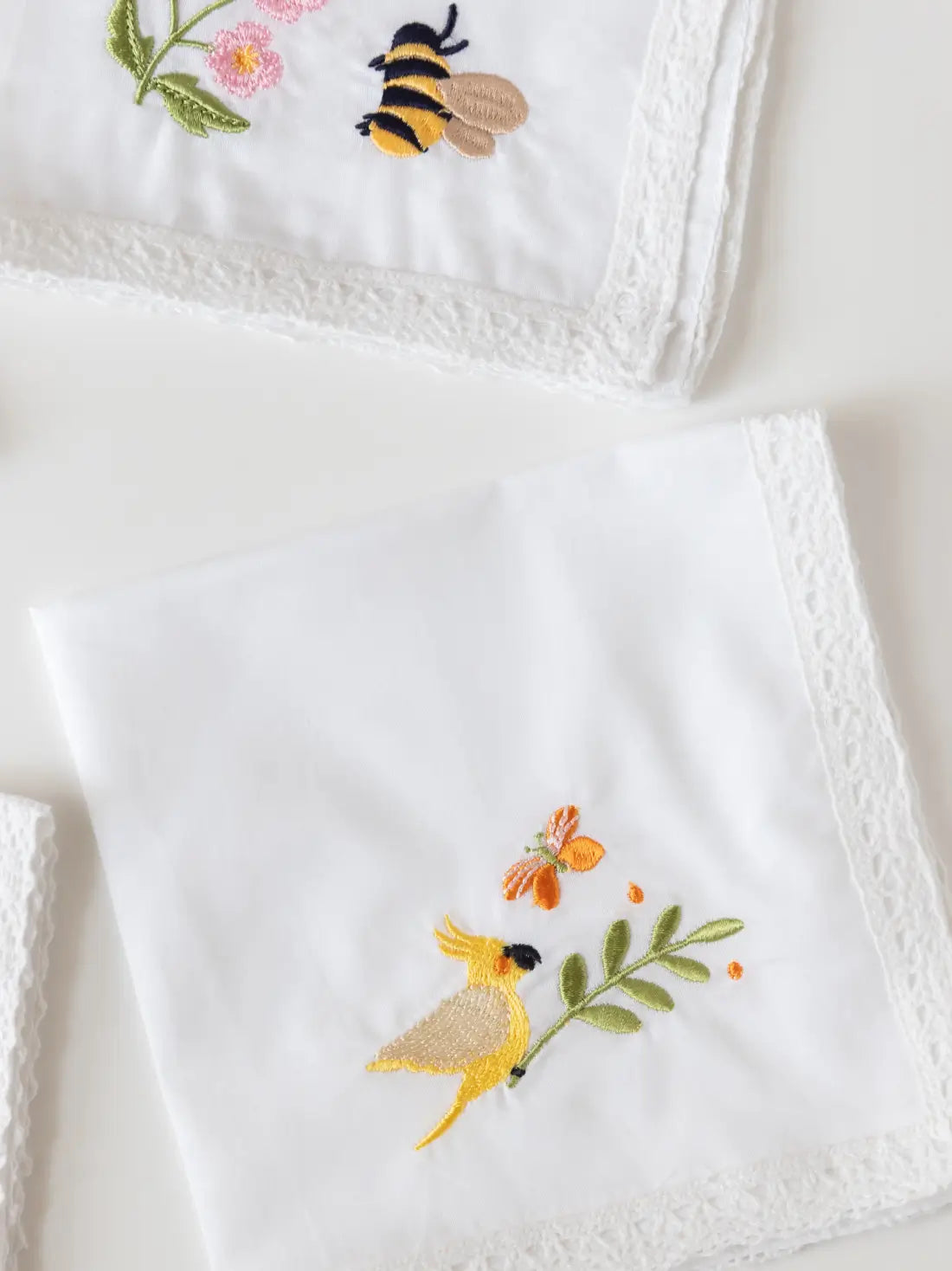 Garden Whimsy handkerchief with embroidered bee motif and lace edging