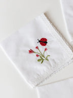 Garden Whimsy handkerchief with embroidered bird motif