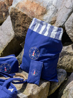 Navy blue lighthouse-embroidered laundry bag with matching toiletry bag, spectacle case and accessories