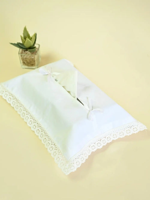 White tissue box cover with lace trim and two ribbon bows