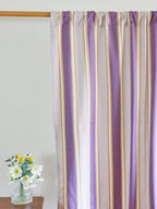 Lavender and white striped curtain with narrow beige lines on a wooden rod